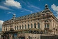 People in front of the Quai d'Orsay Museum facade in Paris.